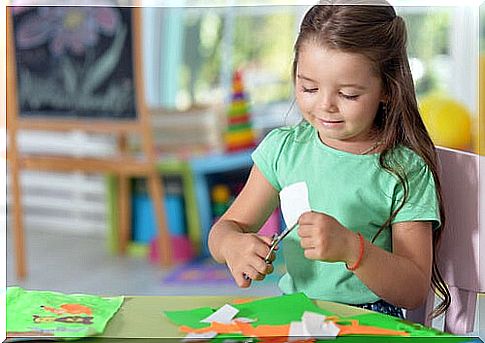 girl cutting in paper