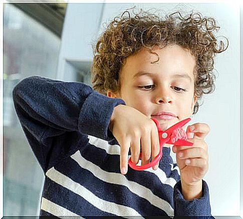 children cutting with scissors