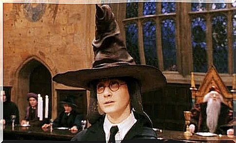 Harry with sorting hat on his head