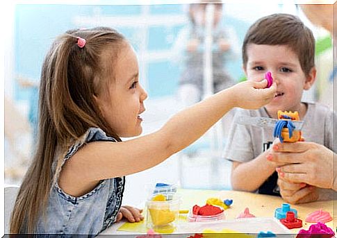 children playing with modeling wax