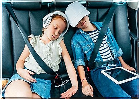 children sleeping in car