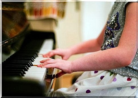 girl playing piano