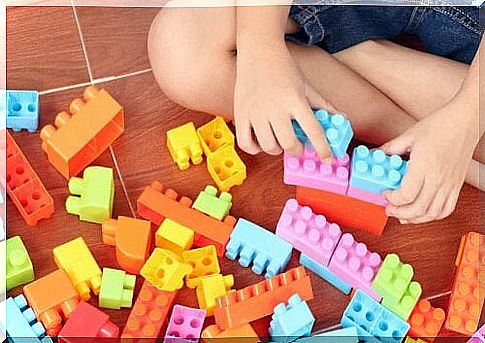 children playing with LEGO