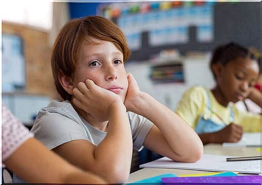 Boy in classroom with lack of respect for teachers.