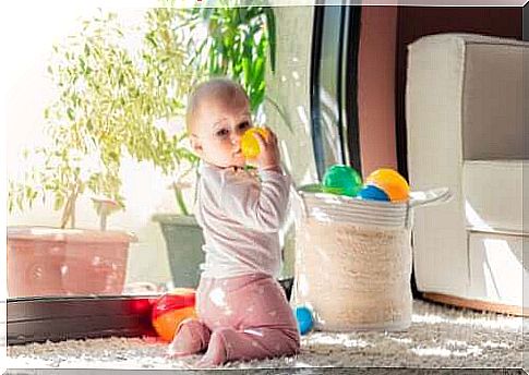 baby playing with plastic ball