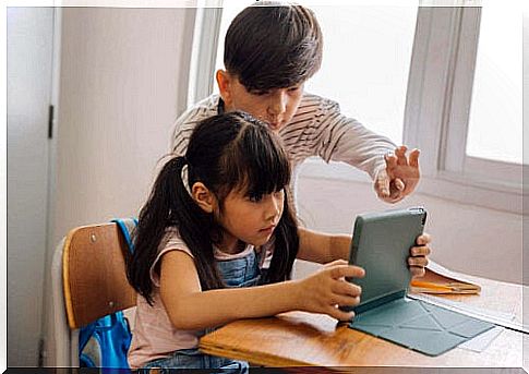 children playing on tablet