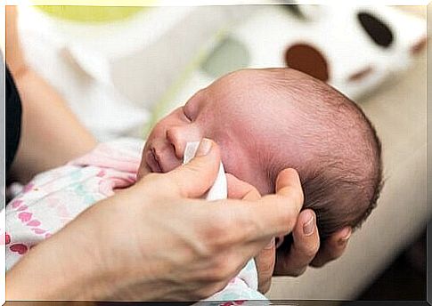 Baby gets his eyes cleaned 