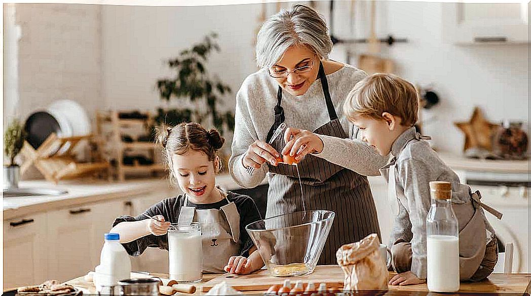 A grandmother baking with her grandchildren