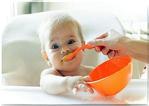 Baby is fed with spoon