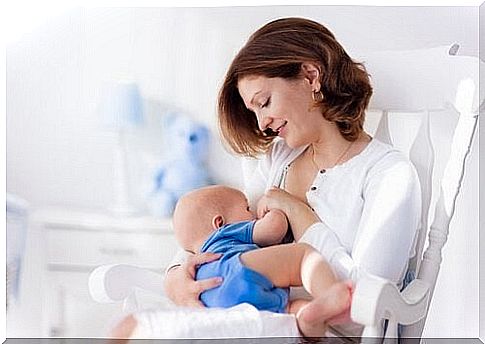 Mother breastfeeds baby