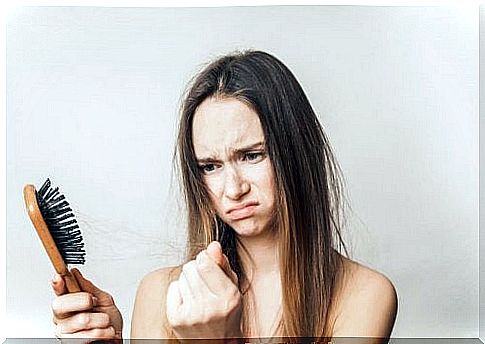 A woman sad about hair loss