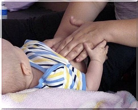 Baby gets tummy massage