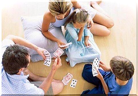 Family playing cards together 