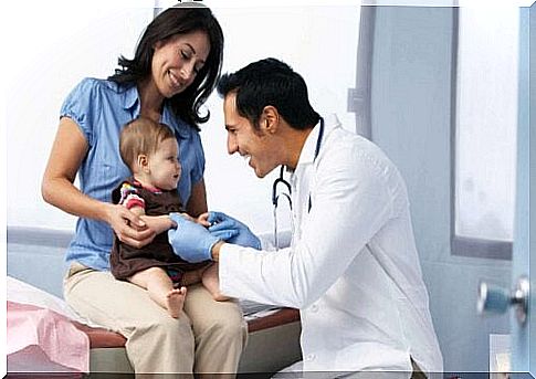 Pediatrician with patient