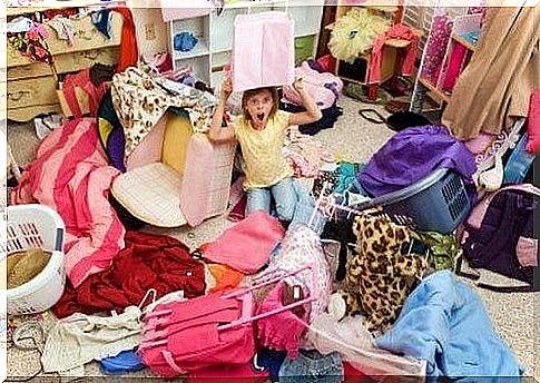 girl sitting in cluttered room