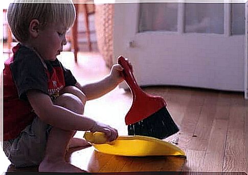 little boy sweeping