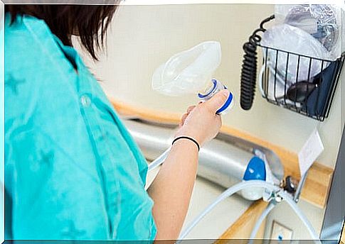 woman holding laughing gas mask