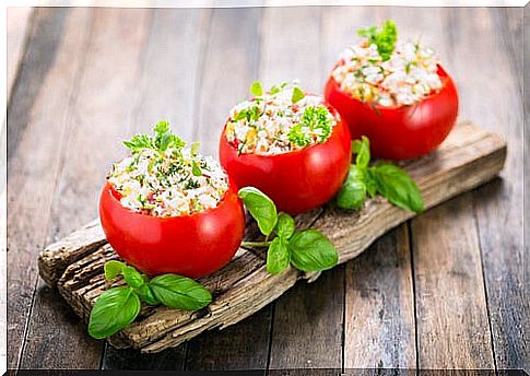 stuffed tomatoes on a piece of board