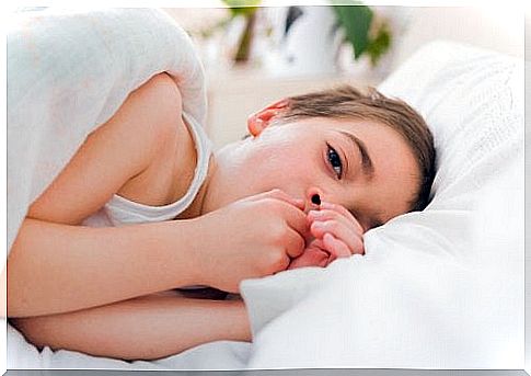 boy lying in bed