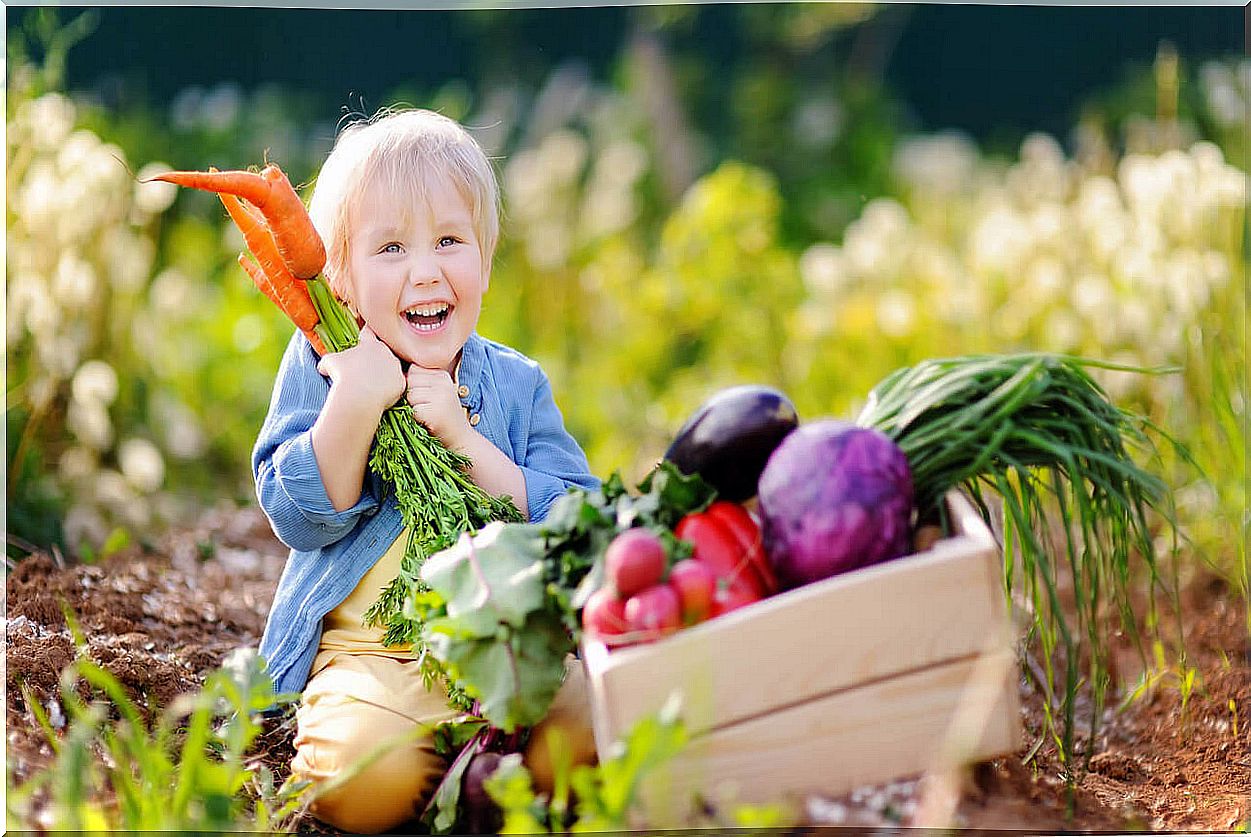 Children with fresh vegetables