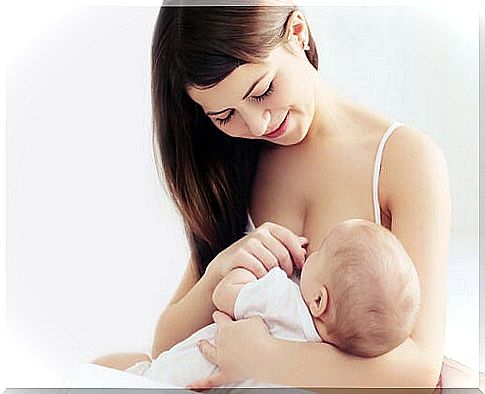 woman breastfeeding baby