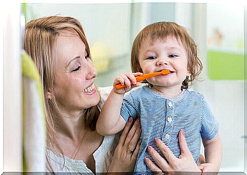 child brushing his teeth