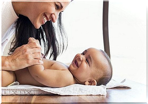 mother playing with baby