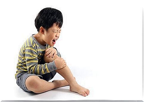 Boy in pain due to growing pains