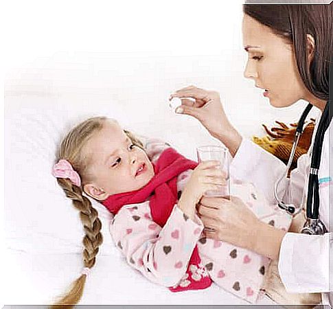 Little girl at the doctor with sore throat.