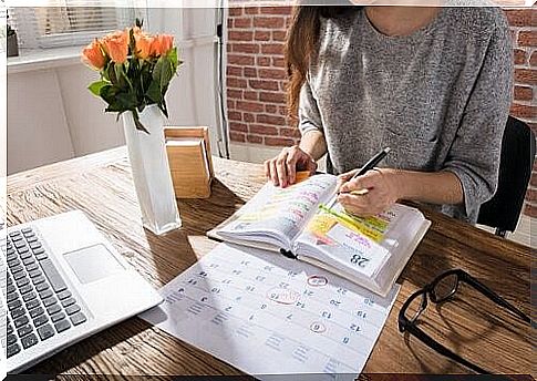 Woman notes in her calendar 