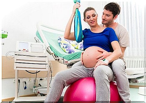 highly pregnant woman on a yoga ball