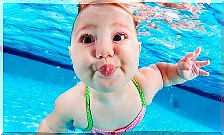 baby underwater in pool