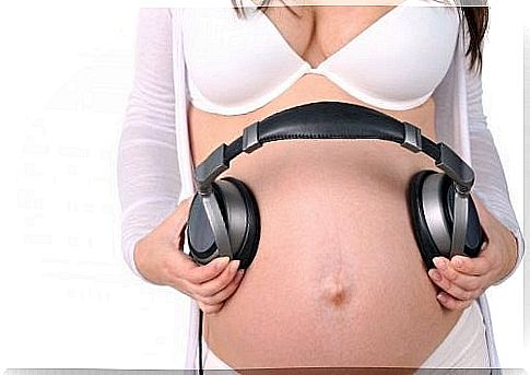 pregnant mother with headphones